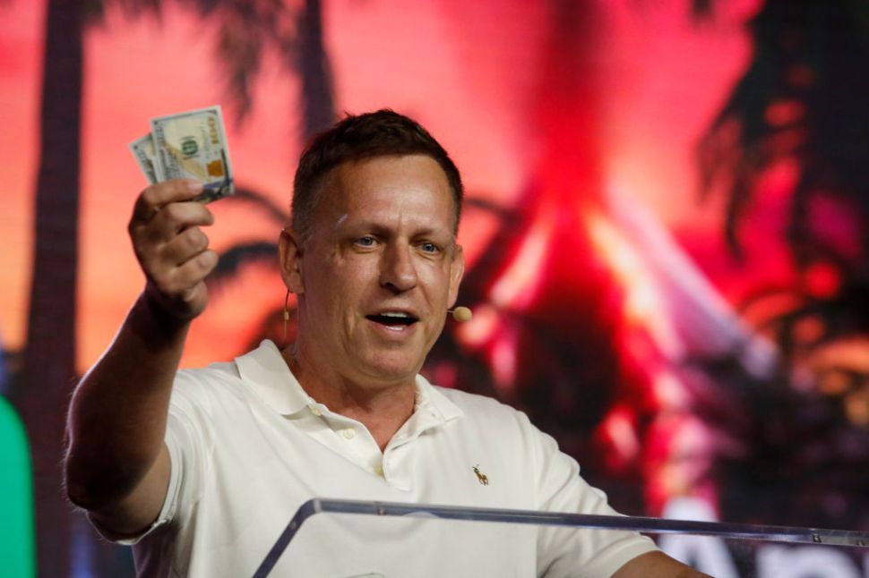 Peter Thiel wearing a white polo shirt.