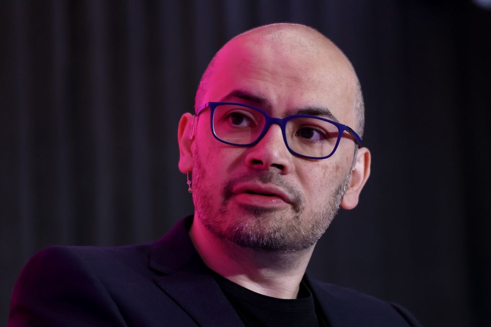 Man in glasses pictured onstage