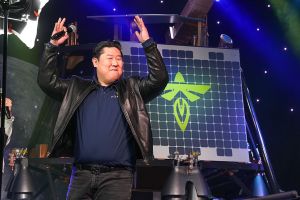 An Asian male in a black leather jacket.