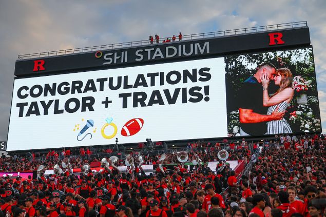 The SHI Stadium scoreboard displays a message to Travis Kelce and Taylor Swift after the announcement of their engagement